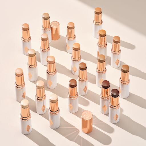 UNREAL SKIN SHEER GLOW TINT FEUCHTIGKEITSSPENDENDER FOUNDATION-STICK 10 TAN